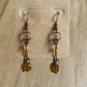 Bohemian wire wrapped earrings in brushed copper finish with amber glass beads